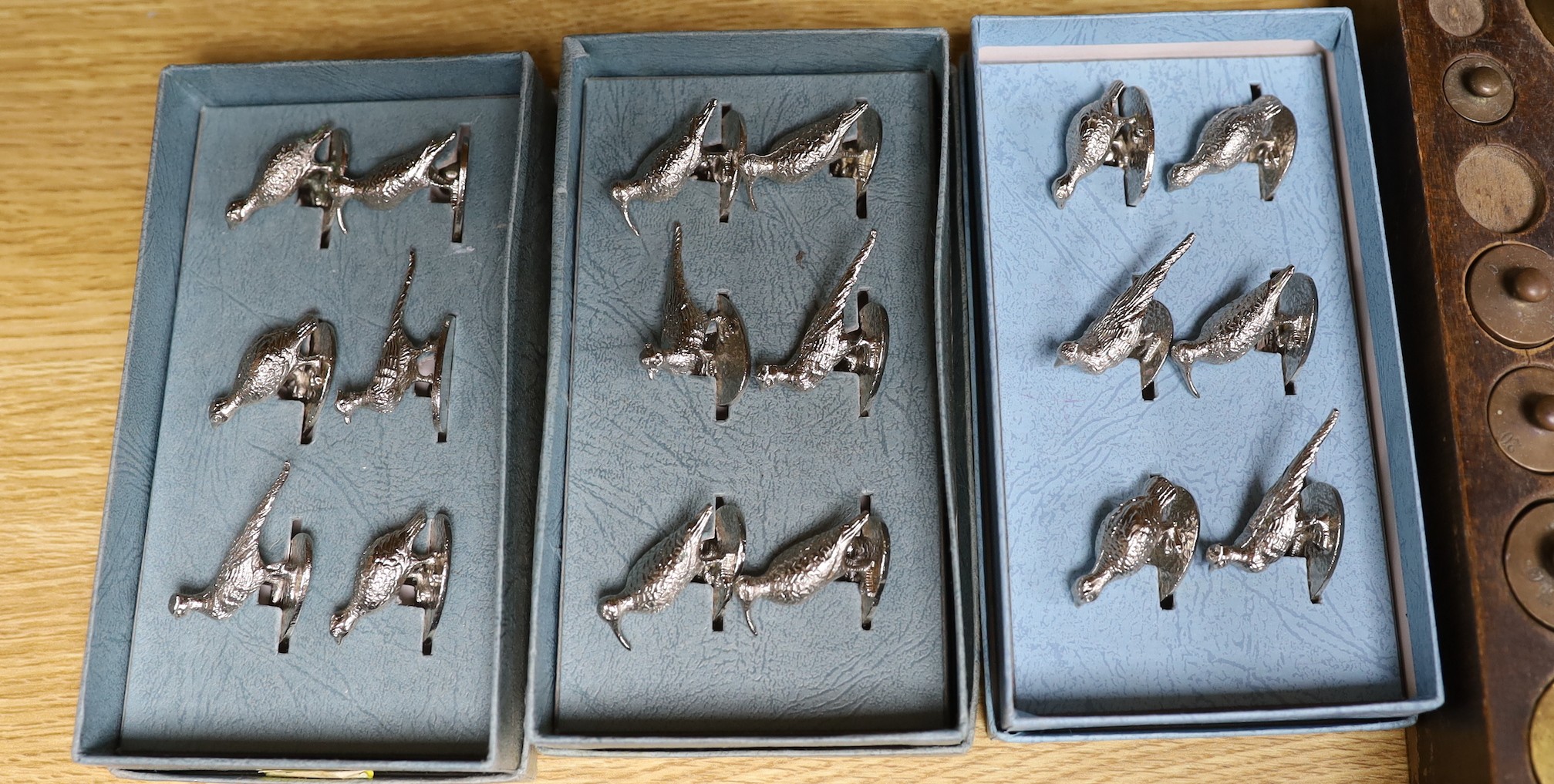 A weight set, a Danish leather bound cup measurement set marked ‘Ria Denmark, three sets of bird menu holders, and other items